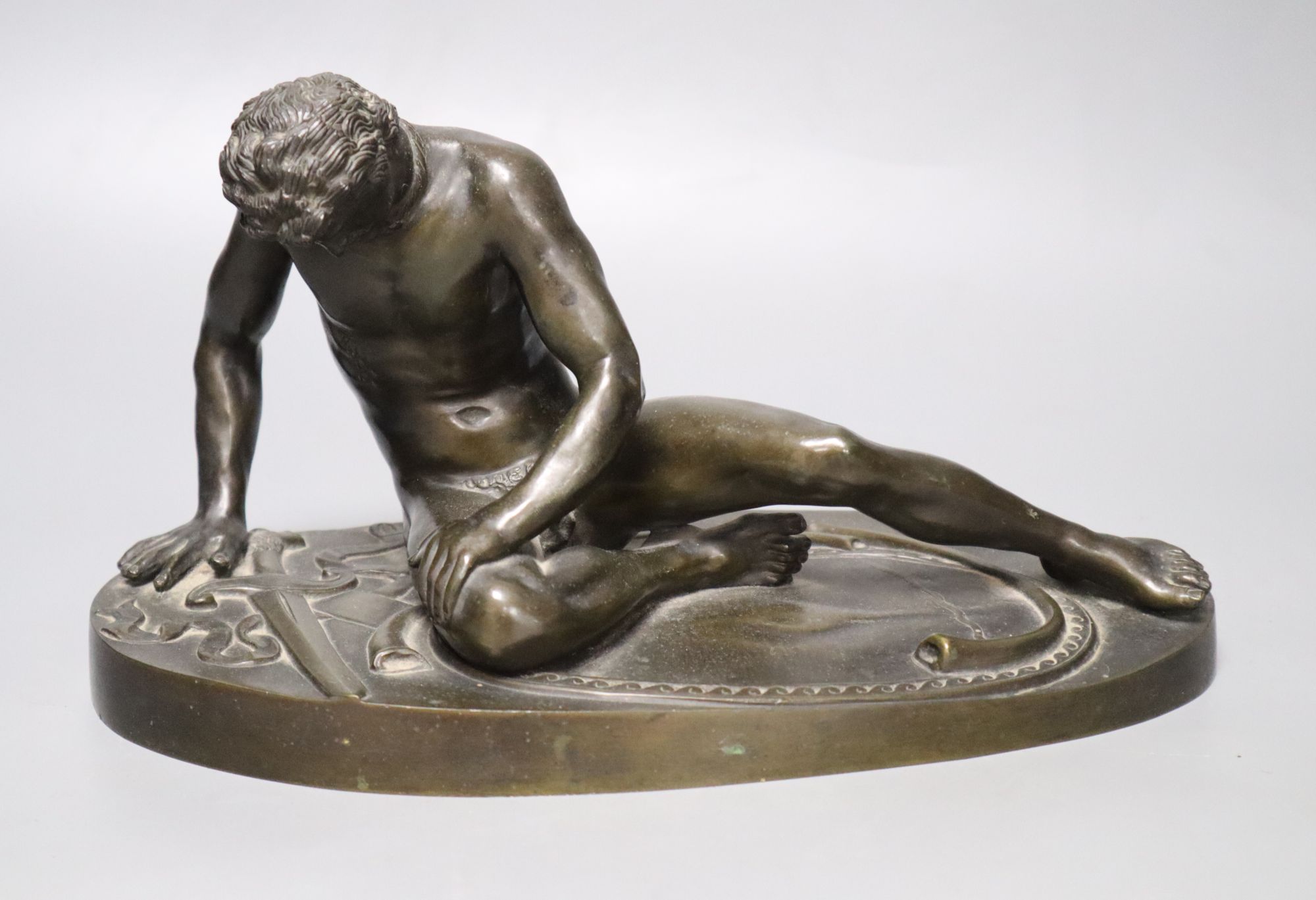 After the Antique. A 19th century bronze figure of the Dying Gaul, length 28cm